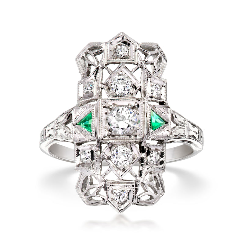 Vintage 18kt white gold ring with diamond center and green synthetic emerald accents