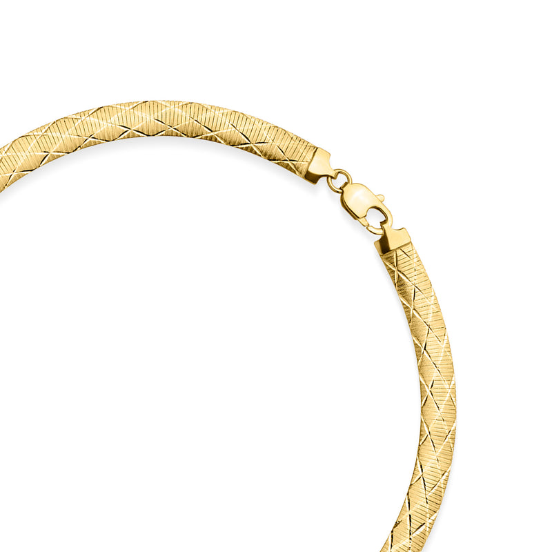 Close-up of yellow gold-plated omega necklace clasp and braided link detailing