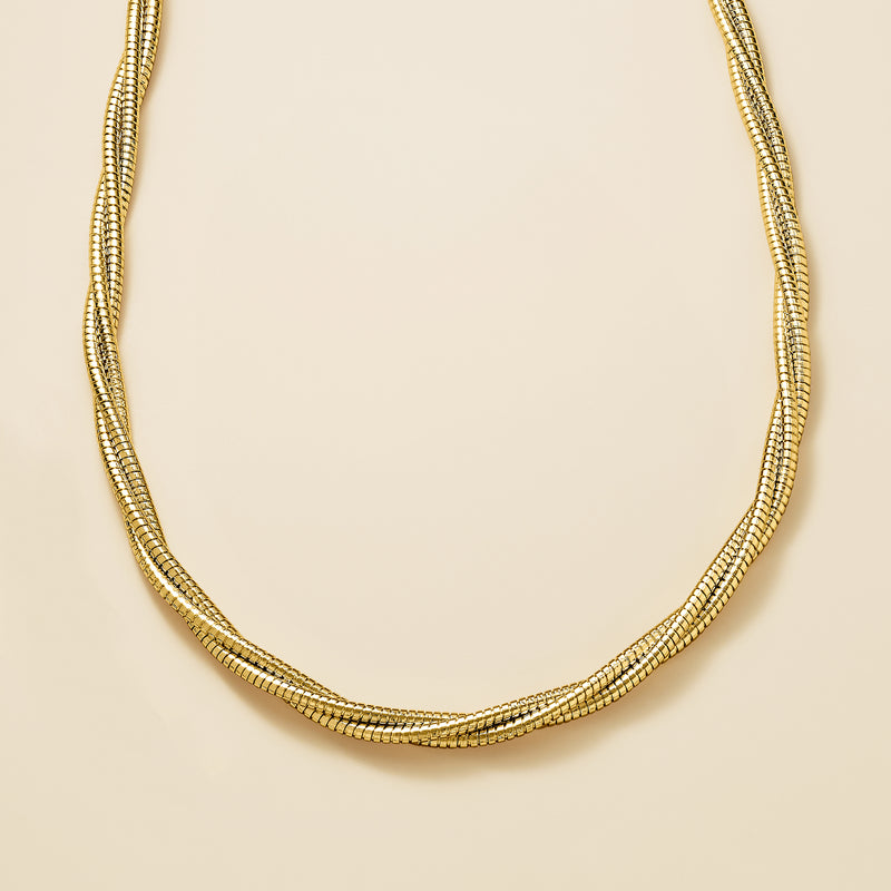Three-strand twisted gold-plated necklace with rounded collar shape.