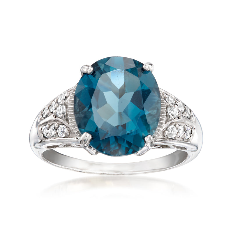 Oval London blue topaz ring with sculpted shoulders and round zircon accents