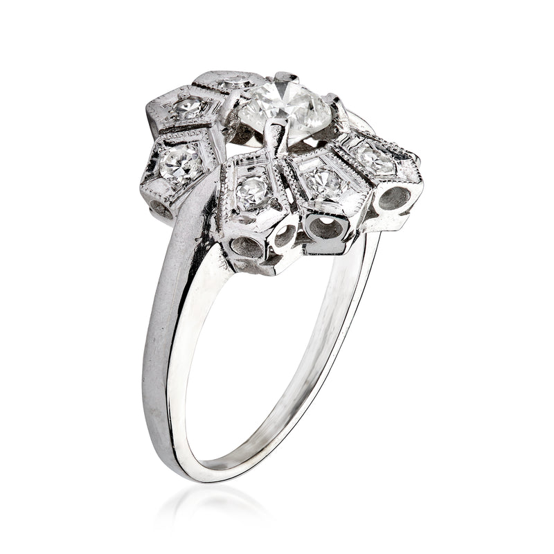 Vintage 14kt white gold diamond filigree ring with openwork halo and small side stones