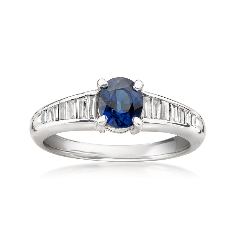 Platinum oval blue sapphire ring with baguette diamond shoulders, cushion-prong setting
