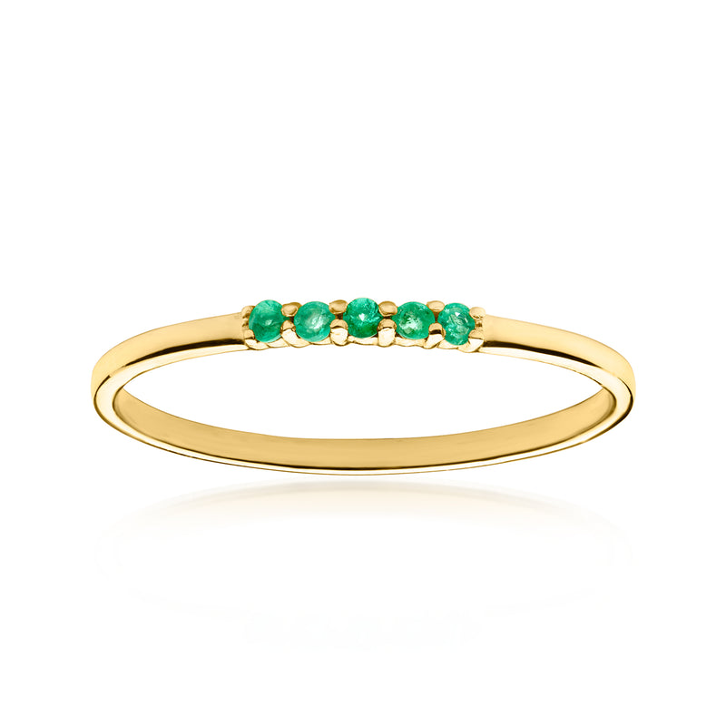 10k yellow gold ring with five green emerald-style gemstones across top