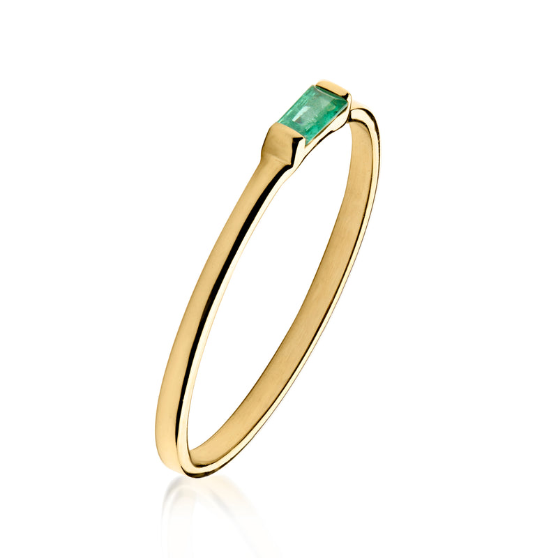 10kt yellow gold ring with emerald-cut green gemstone, angled view of band