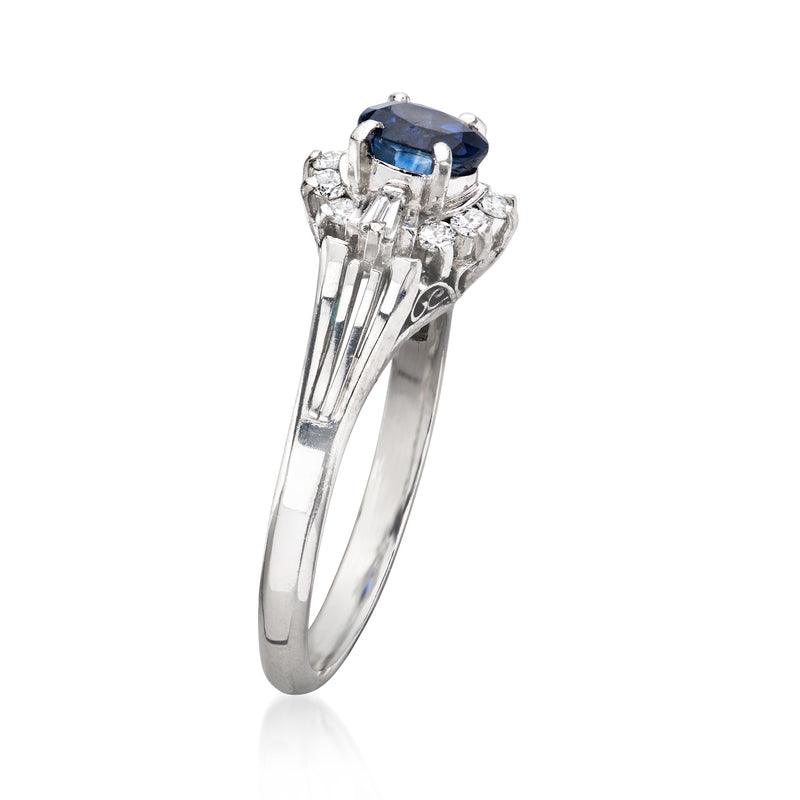 Platinum vintage sapphire ring side view with cushion-cut blue center and diamond shoulders