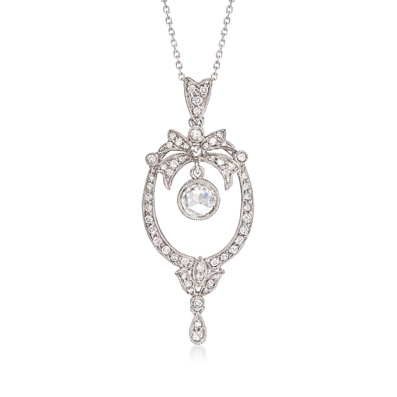 Diamond pendant necklace with ornate heart-shaped frame and teardrop bail, white gold