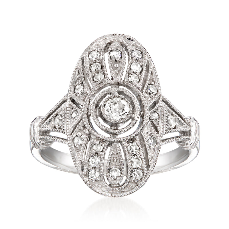 Vintage platinum diamond filigree ring with oval halo center stone