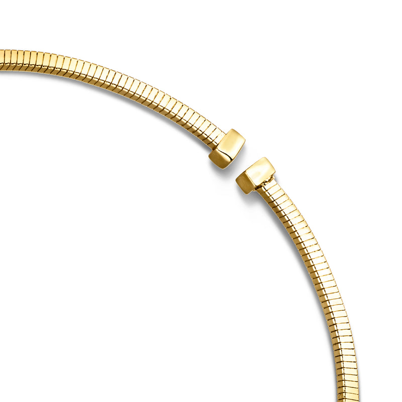 Close-up of yellow gold-plated omega necklace clasp and textured link ends