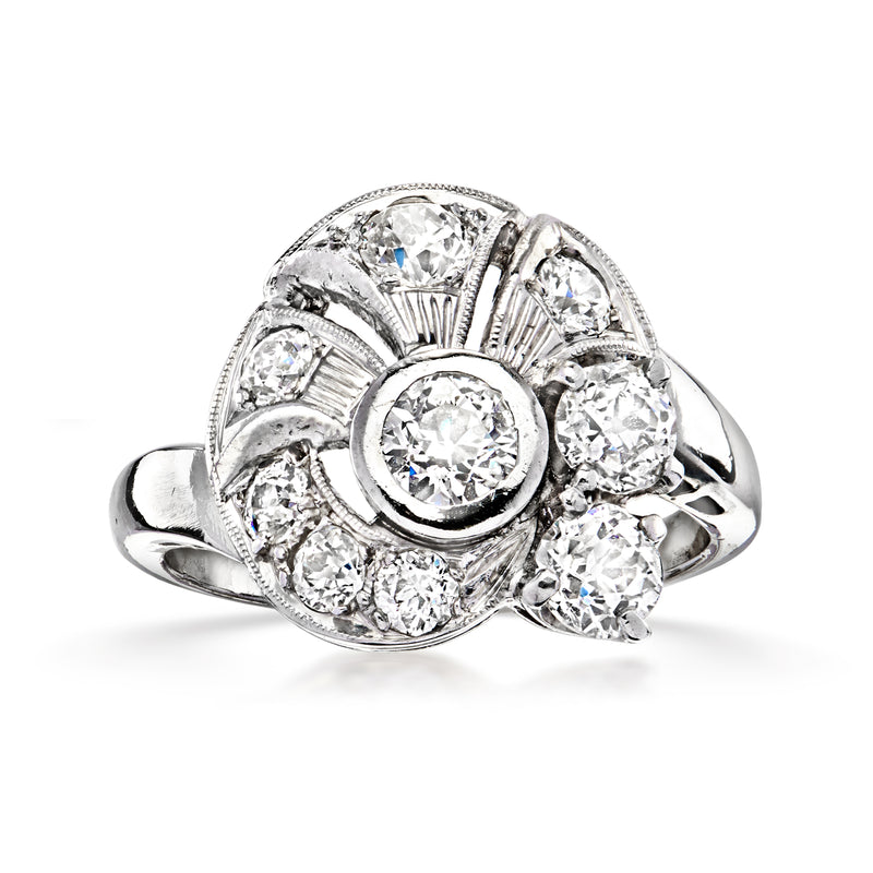 Platinum swirl diamond cluster ring with oval center stone and round accents