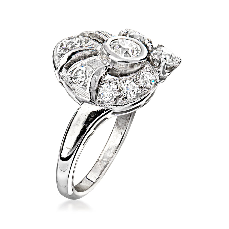 Platinum vintage swirl diamond ring with oval center stone and side round clusters
