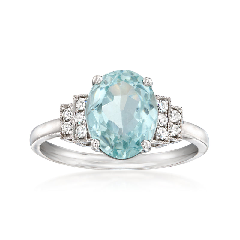 Oval aquamarine ring with diamond halo and prong settings, white gold band