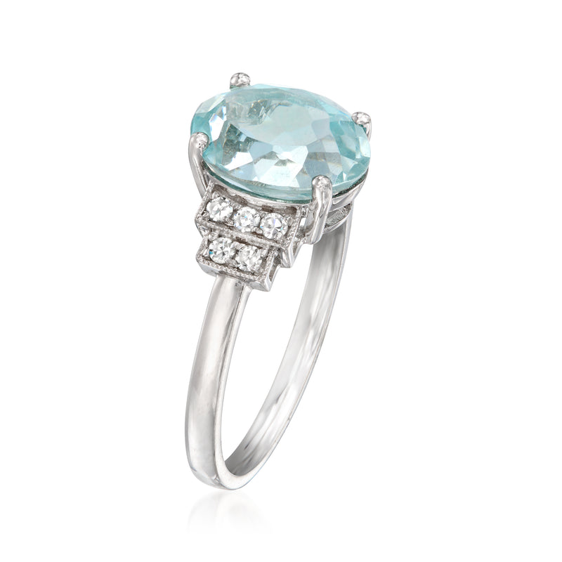 Oval aquamarine ring with diamond accents on the shoulders, white gold