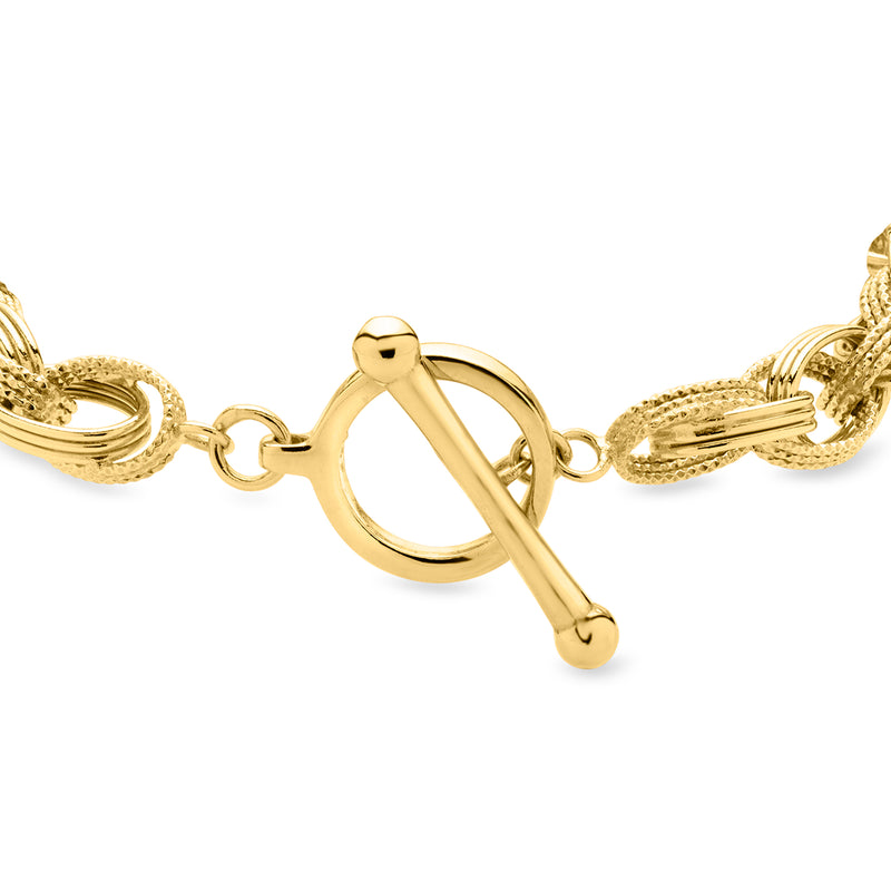 Gold-plated toggle bracelet close-up with circular ring clasp and chain link details