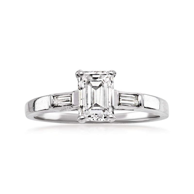 Vintage white gold diamond ring with emerald-cut center stone and baguette side stones