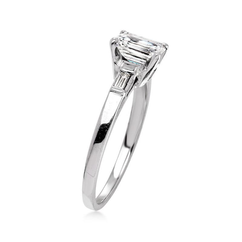 Vintage white gold diamond ring with emerald-cut center stone and prong-set profile view