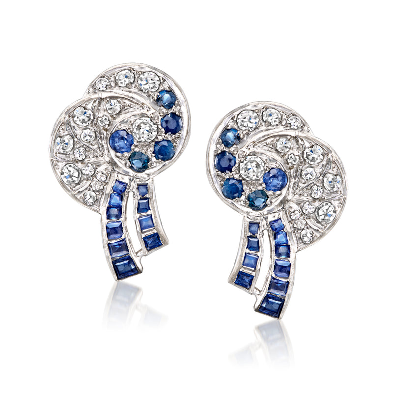White gold swirl stud earrings with sapphire and diamond oval cluster, post backs