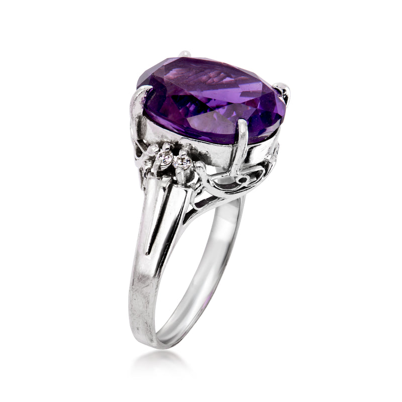 Side view of platinum ring with oval amethyst gemstone and diamond prong accents