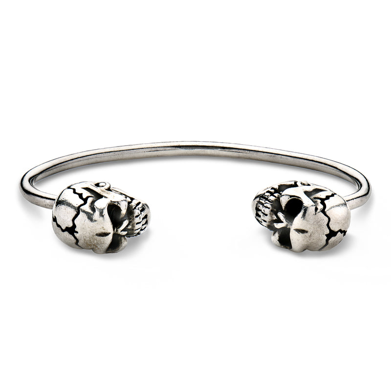 Sterling silver skull cuff bracelet with two detailed skull heads