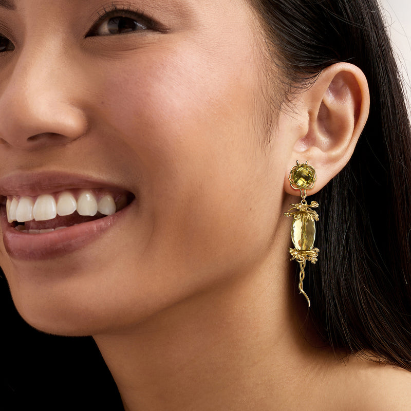 Ornate floral lemon quartz drop earrings in 18k yellow gold, worn on model