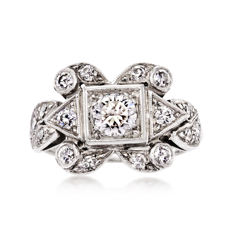 Platinum vintage diamond ring with rectangular center stone and halo side accents