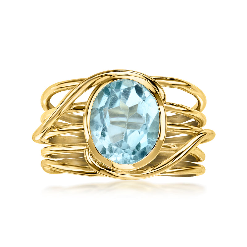 Oval sky blue topaz ring in gold-tone crisscross setting with openwork band