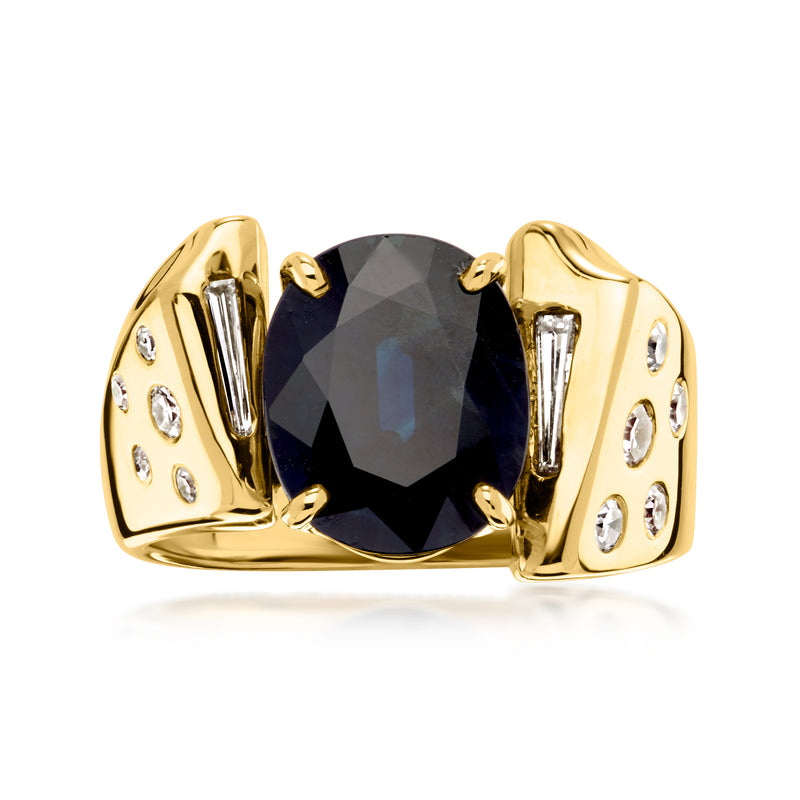 14kt yellow gold ring with dark blue oval sapphire and small diamond accents