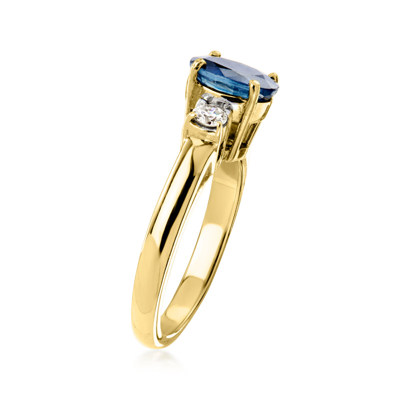 Yellow gold ring with blue sapphire in bezel setting and diamond accent below