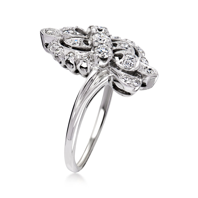 18kt white gold openwork diamond ring, side view with swirling prongs and round stones