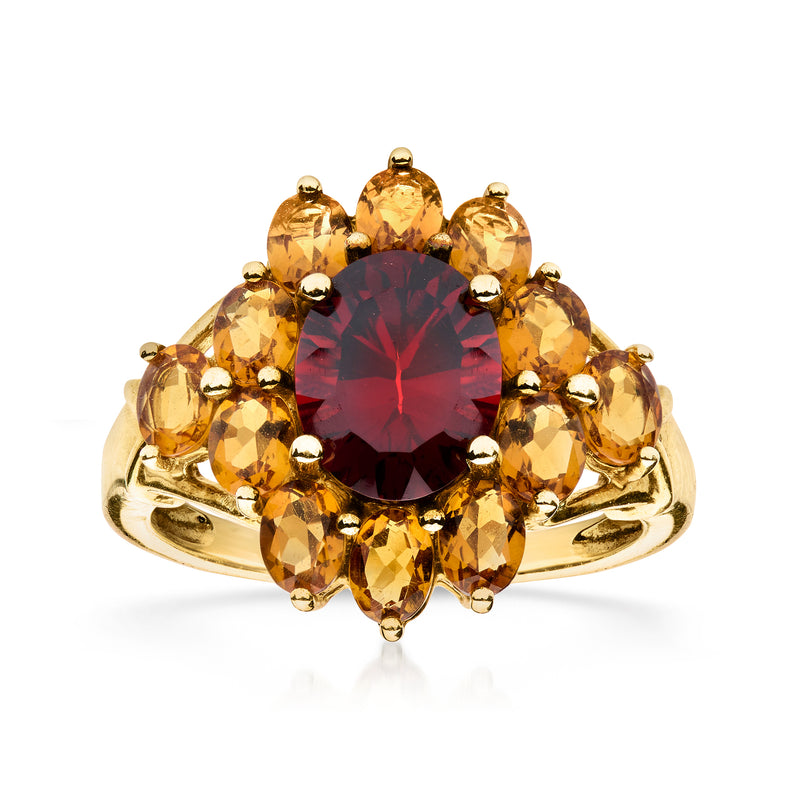 10kt yellow gold ring with dark red oval center and yellow citrine halo stones