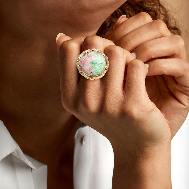 Vintage multicolored jade ring on hand, oval cabochon in 14kt yellow gold bezel