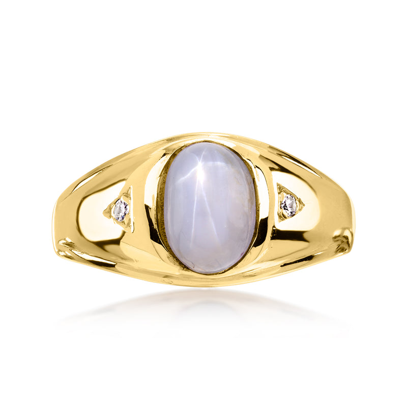 Vintage 14kt yellow gold ring with oval star sapphire and two diamond side accents
