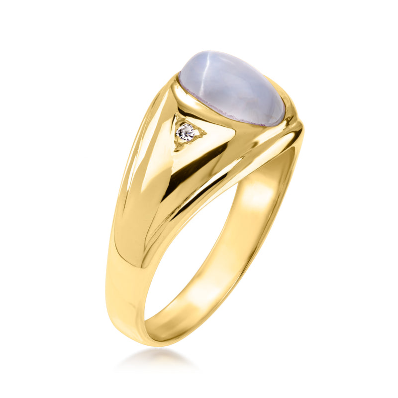 14kt yellow gold ring with oval star sapphire cabochon and prong-set diamond detail