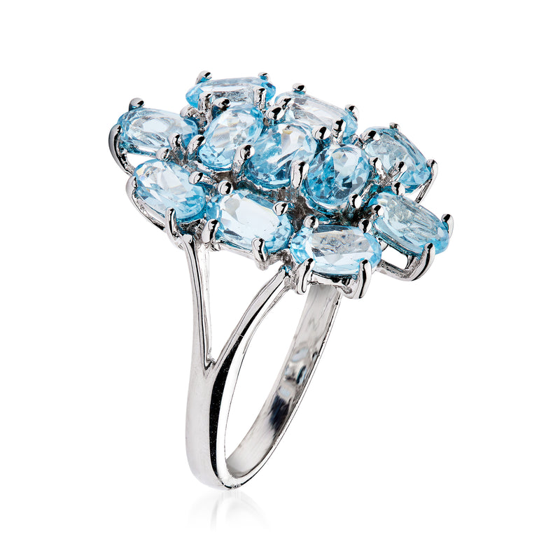 Sky blue topaz cluster ring in white gold with mixed-cut gemstones, side view