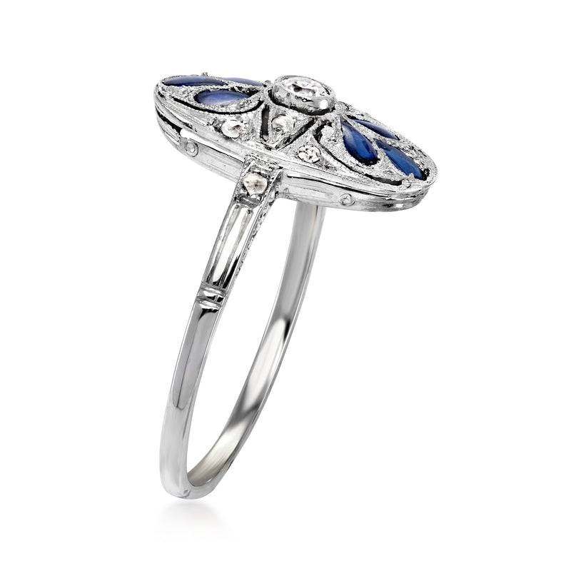 Platinum vintage ring side view with blue oval stone cluster and pave diamond details