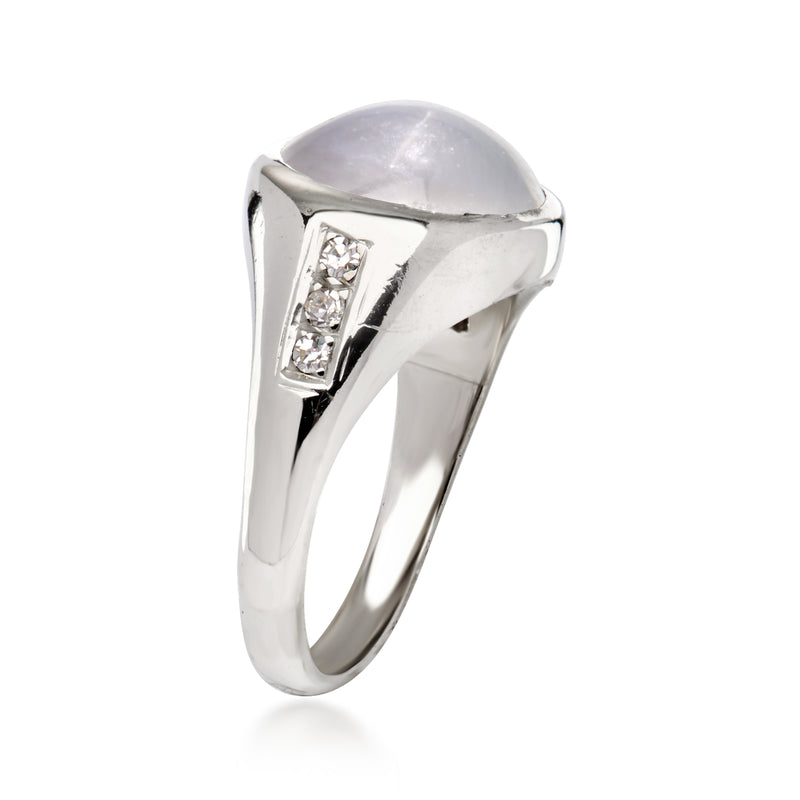 14kt white gold star sapphire ring with gray oval cabochon and two baguette diamonds
