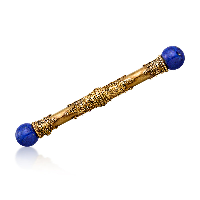 Vintage bar pin in 14kt yellow gold with blue lapis ends and engraved center.