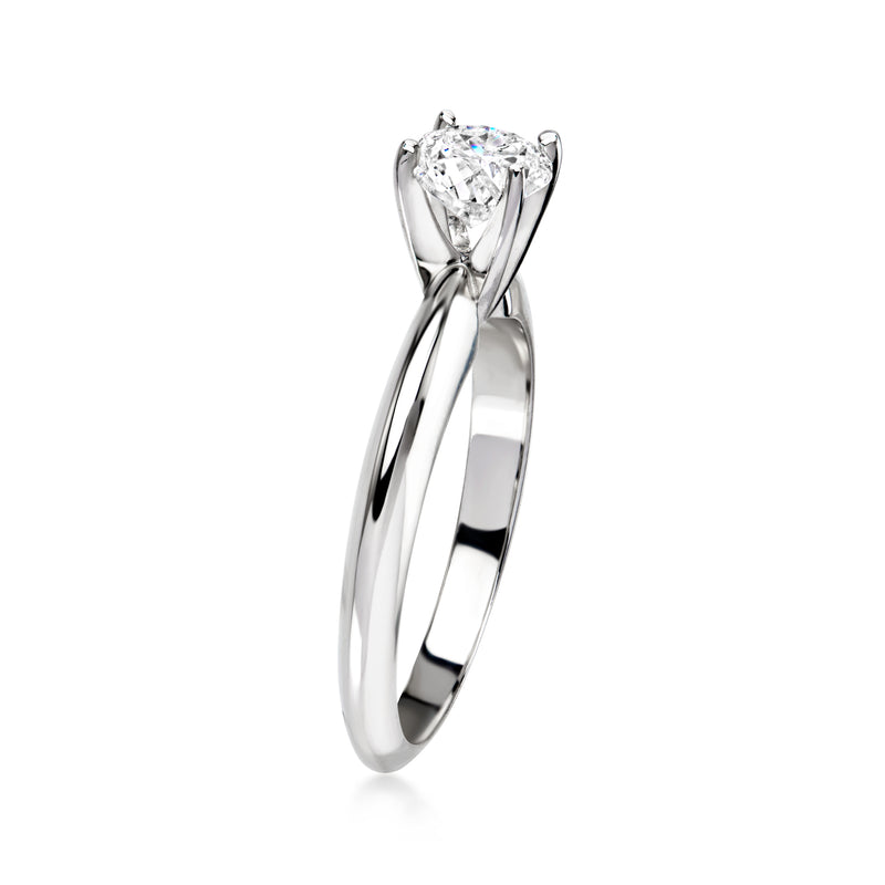 14kt white gold diamond solitaire ring with round center diamond and raised prong setting
