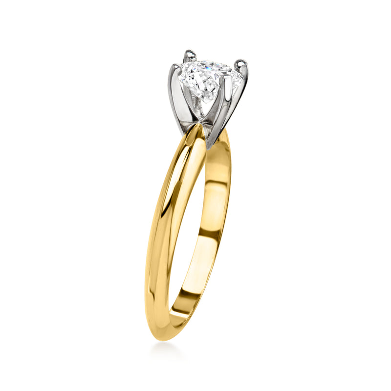 Solitaire diamond ring on 14kt yellow gold band with lifted prong setting