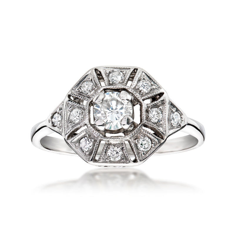 Vintage white gold diamond ring with round center stone and geometric halo