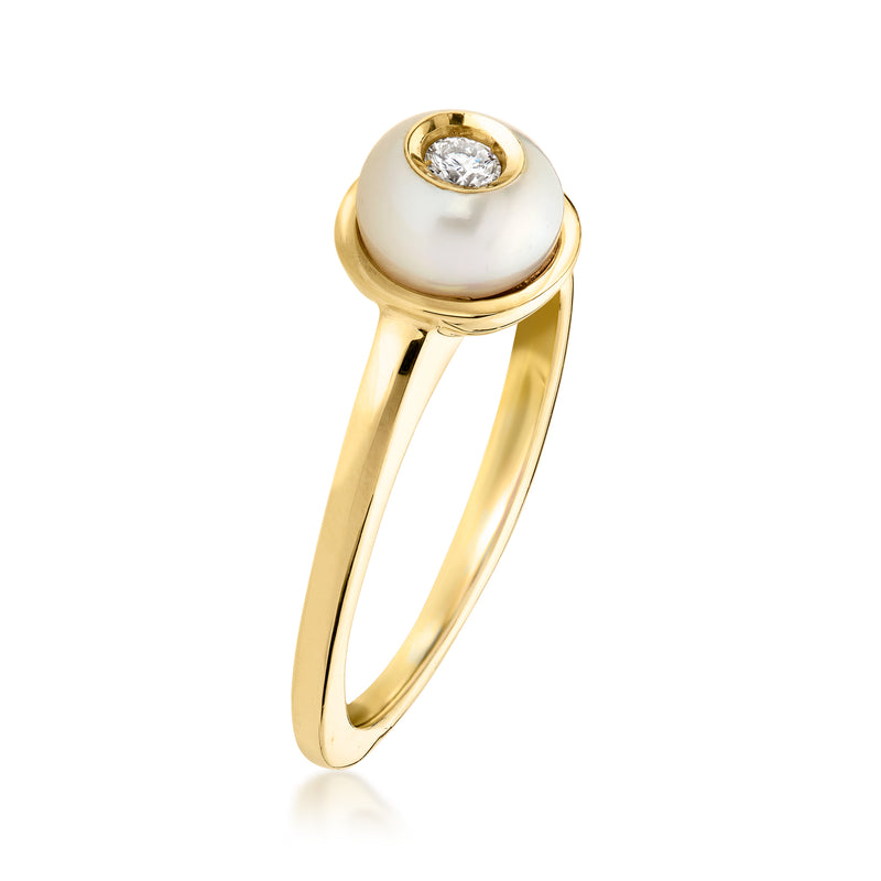 14kt yellow gold ring with raised white pearl top and bezel-set diamond