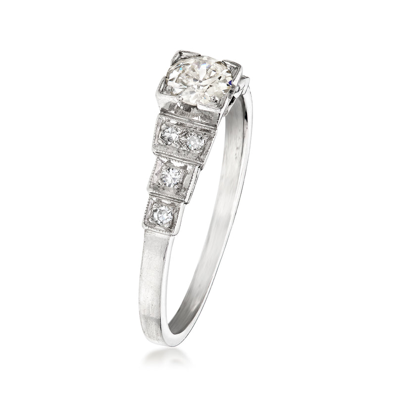 Platinum vintage diamond ring, stepped square side stones and cushion-cut center