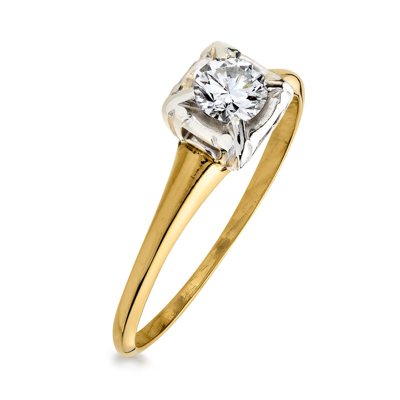 Angled view of vintage yellow gold ring with round diamond in square prong setting