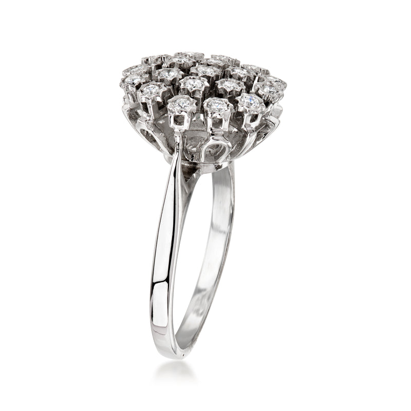 Vintage 14kt white gold diamond cluster ring, side view with raised crown