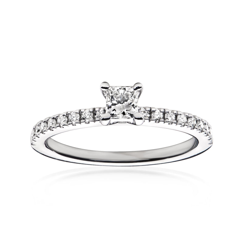 White gold diamond ring with center solitaire and pavé band