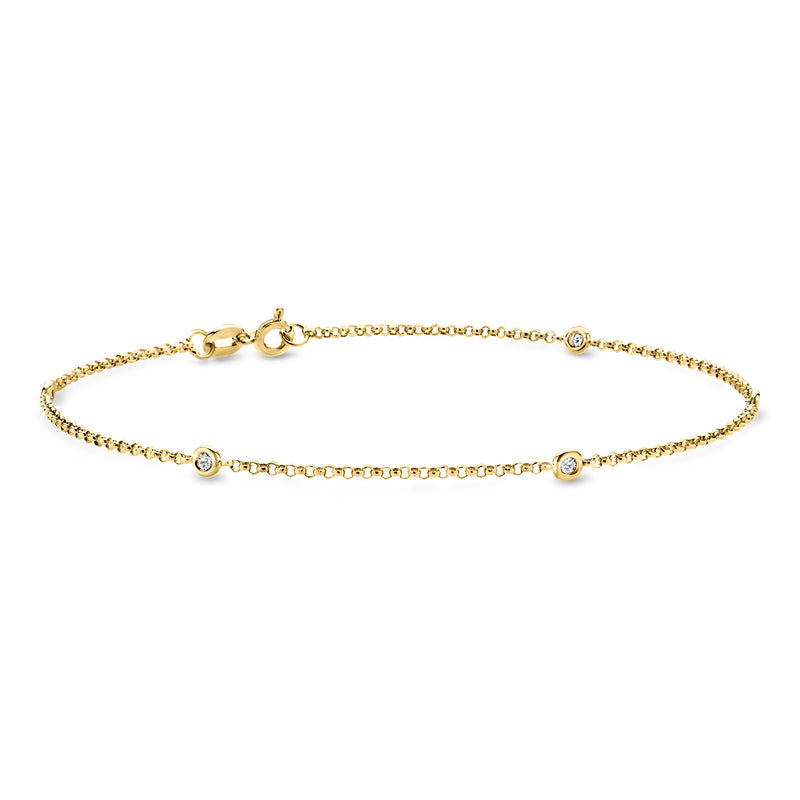 Yellow gold station anklet with round diamond-style stones along a fine chain