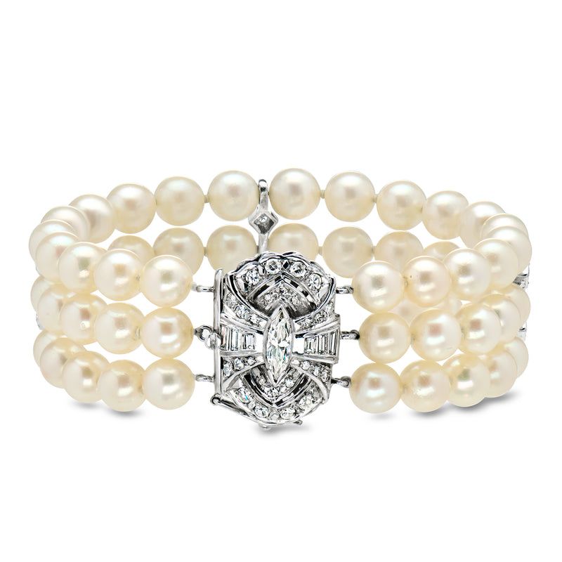 Three-row pearl bracelet with ornate diamond clasp, white gold, front view