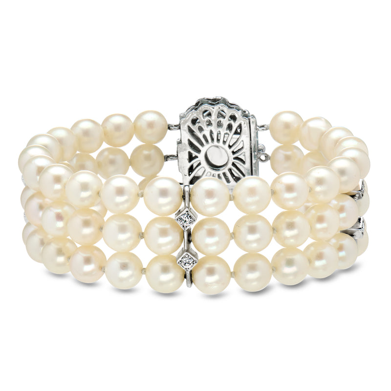 Three-row pearl bracelet with openwork diamond clasp detail, white gold