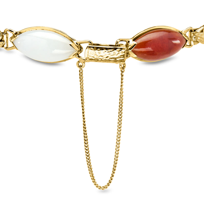 14kt yellow gold jade bracelet detail with oval red and white stones and dangling chain