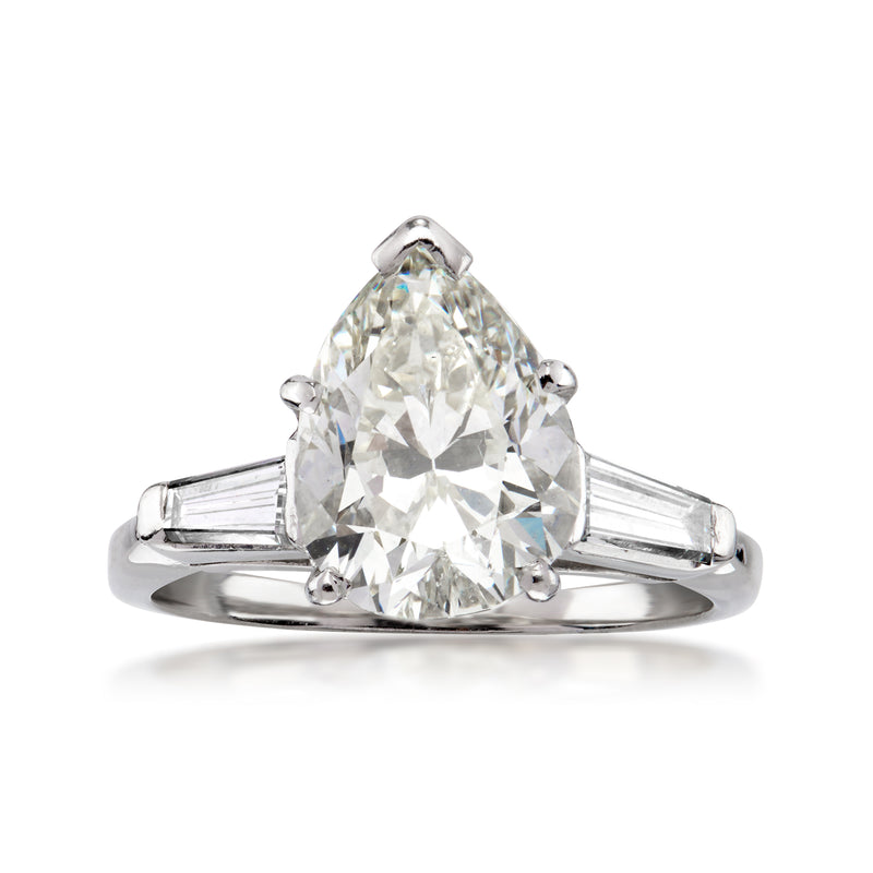 Platinum vintage diamond ring with large cushion-cut center and baguette side stones