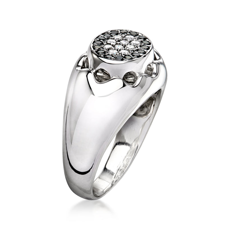 Vintage white gold ring with oval black-and-white diamond cluster top, high setting